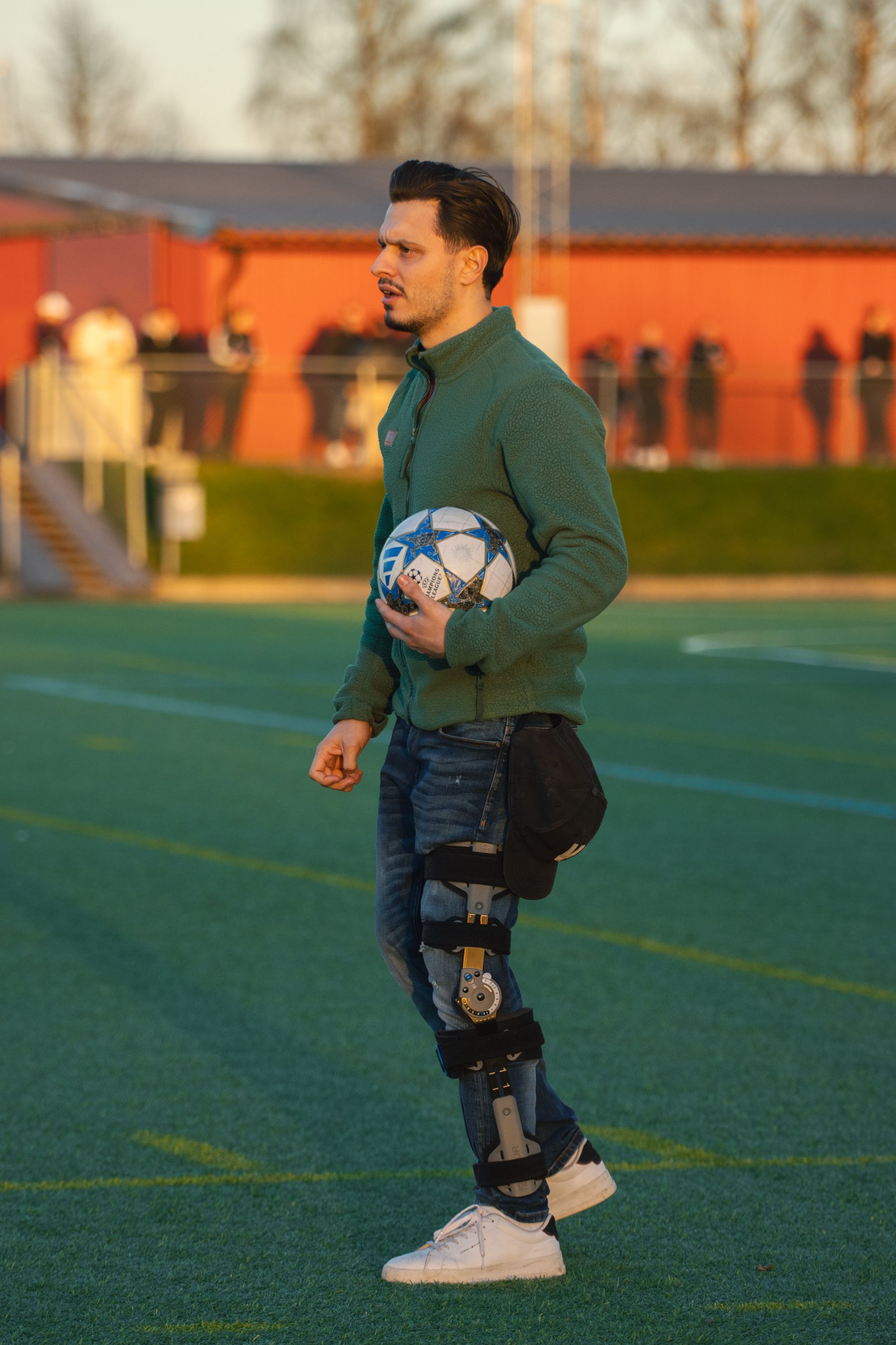 Athlete with knee brace returning to soccer