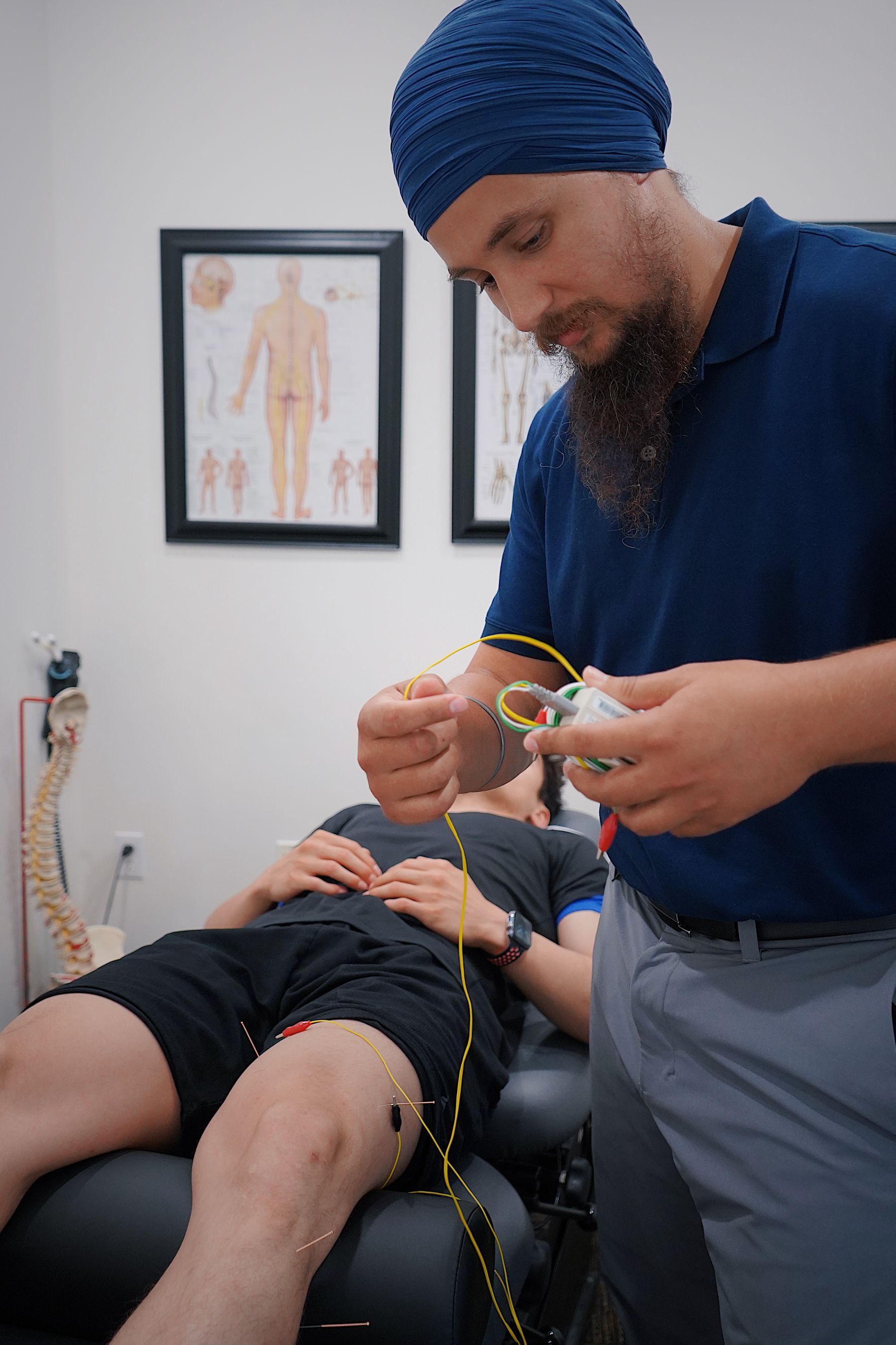 EMG biofeedback electrodes on a patient's leg